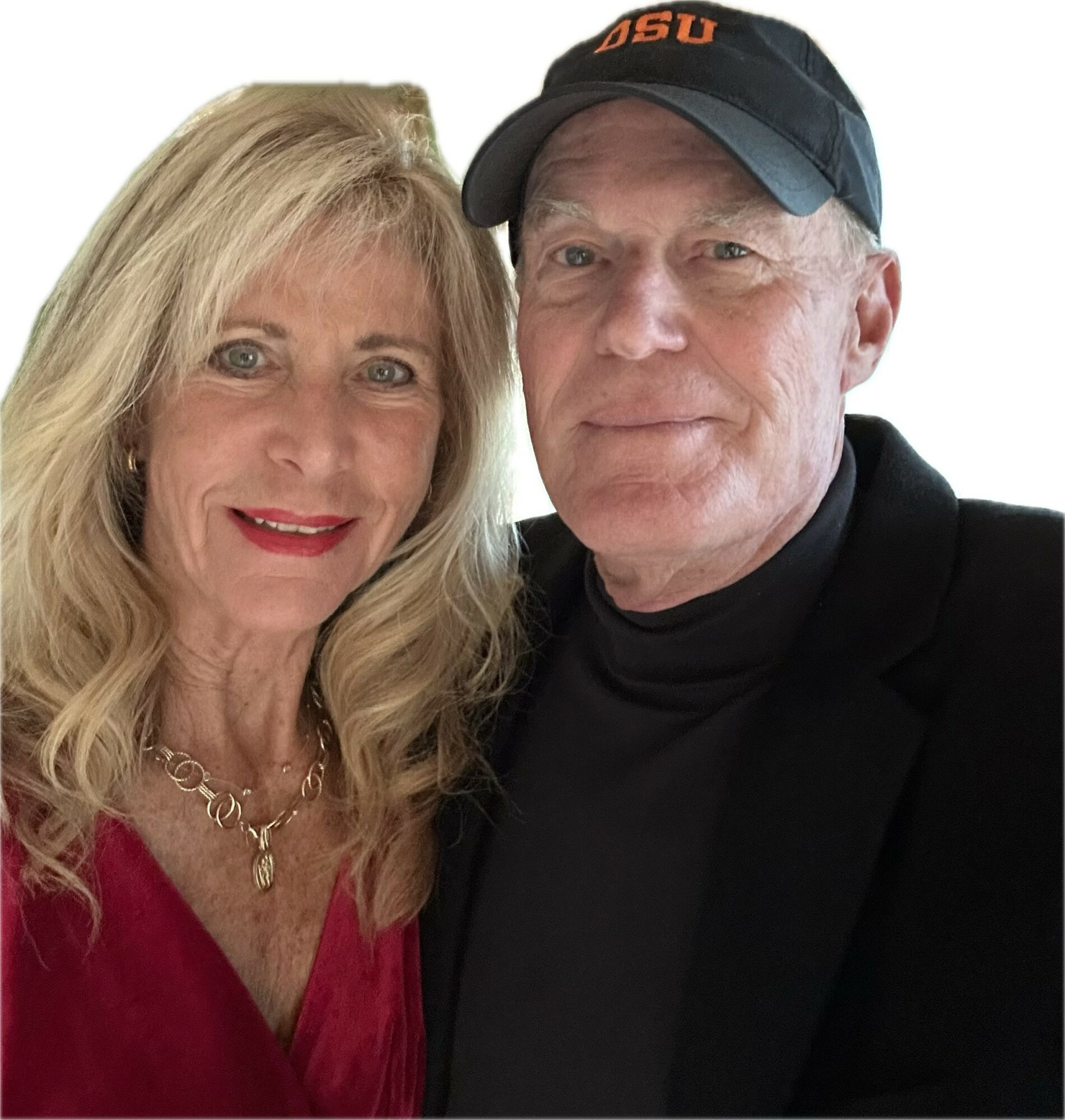 A woman with blonde hair and a man with a cap, both smiling, close together against a white background.