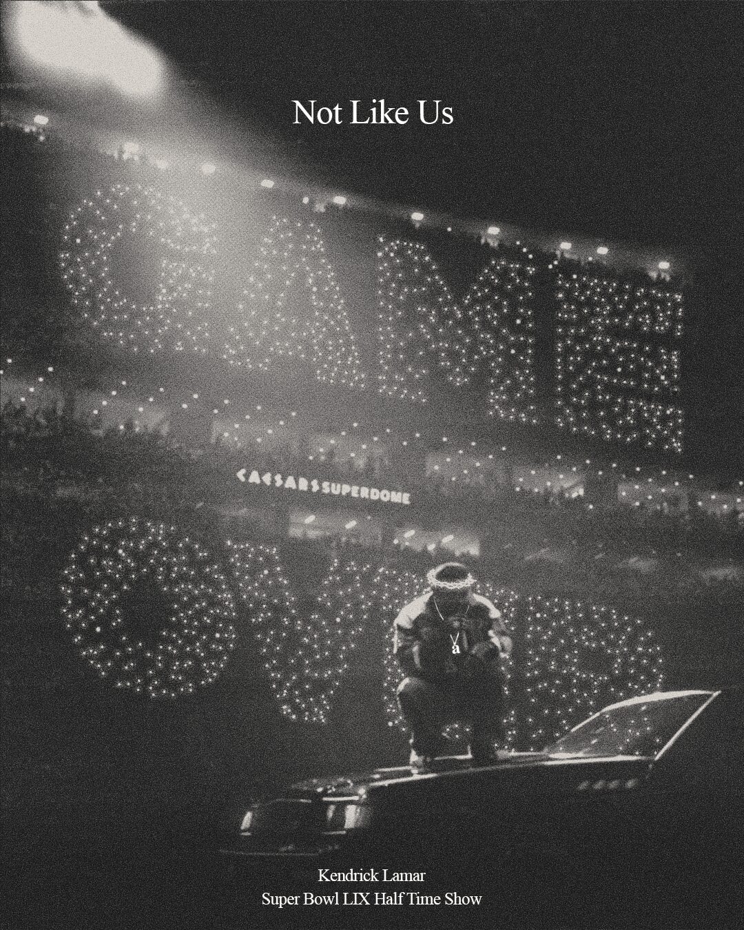A person sitting on a platform in a stadium with illuminated signs reading 'CAVE' and 'LOVE' in the background, black and white.