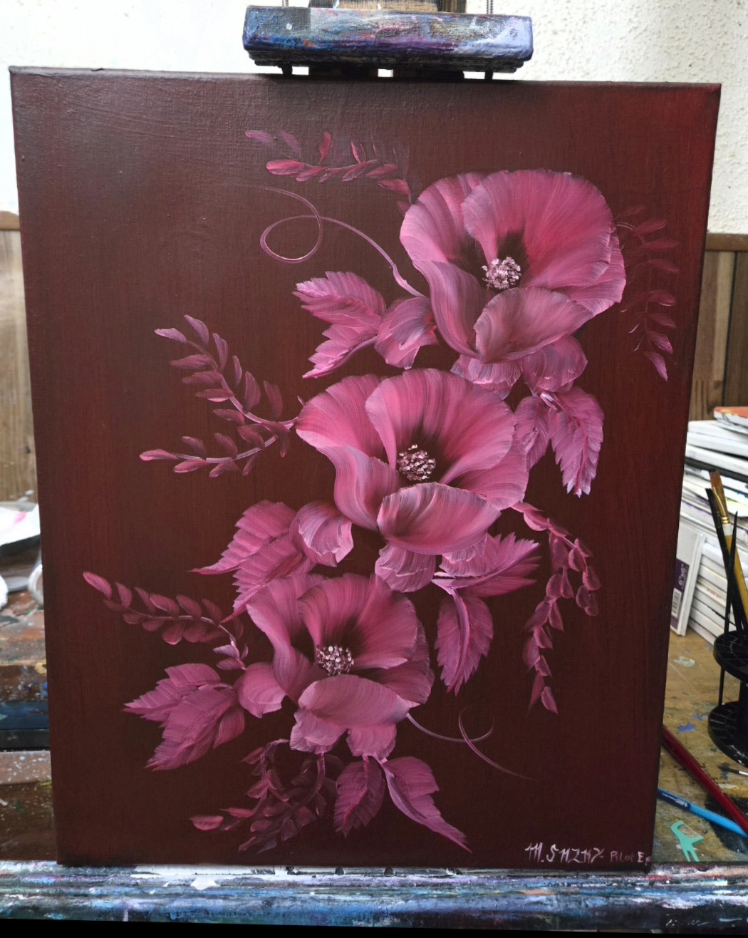 Painting of pink flowers with dark background, featuring large blossoms and leaves, on canvas. Word signature in bottom right corner.