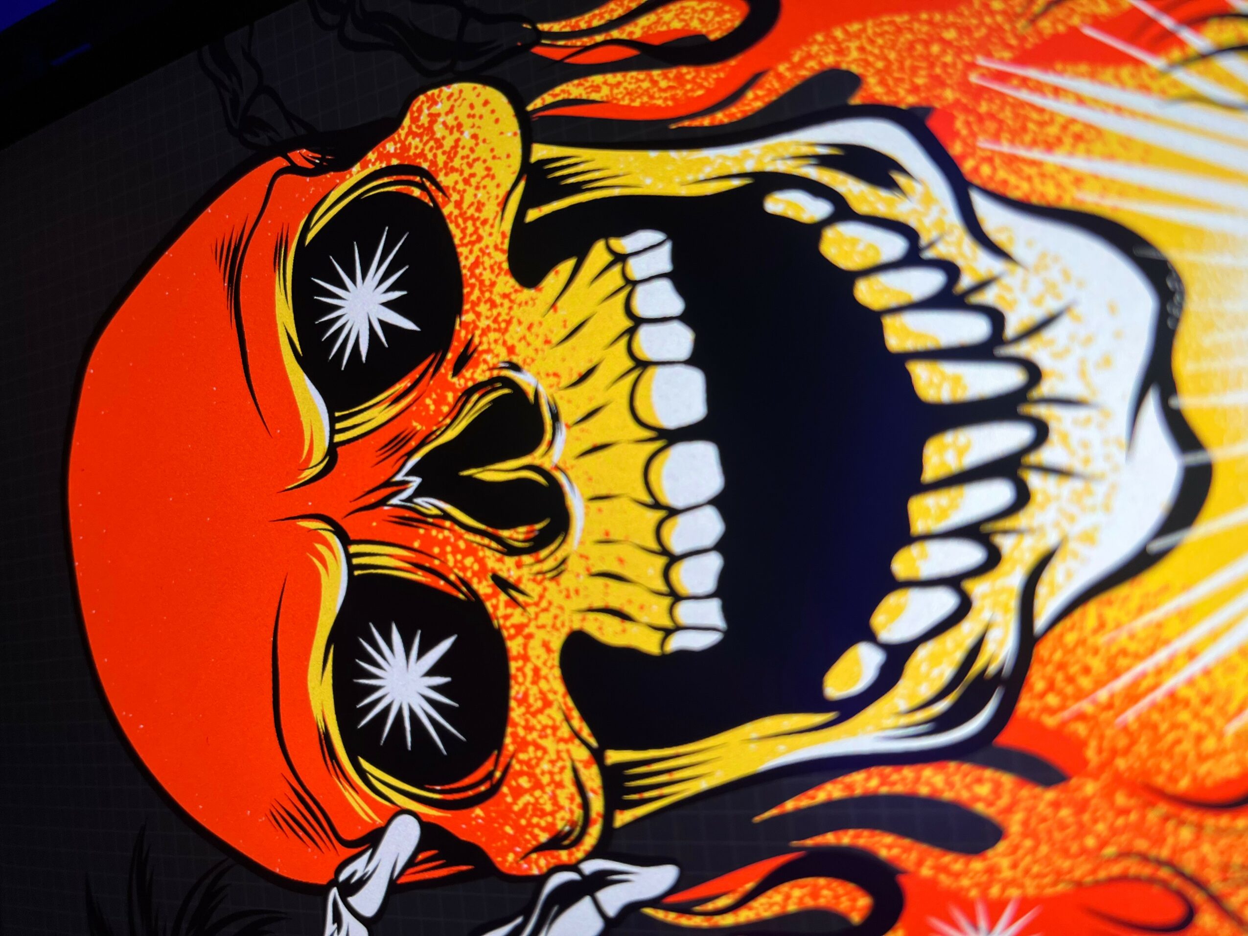 Colorful skull with fiery background, large teeth, and star-like eyes, in a comic or graphic style.