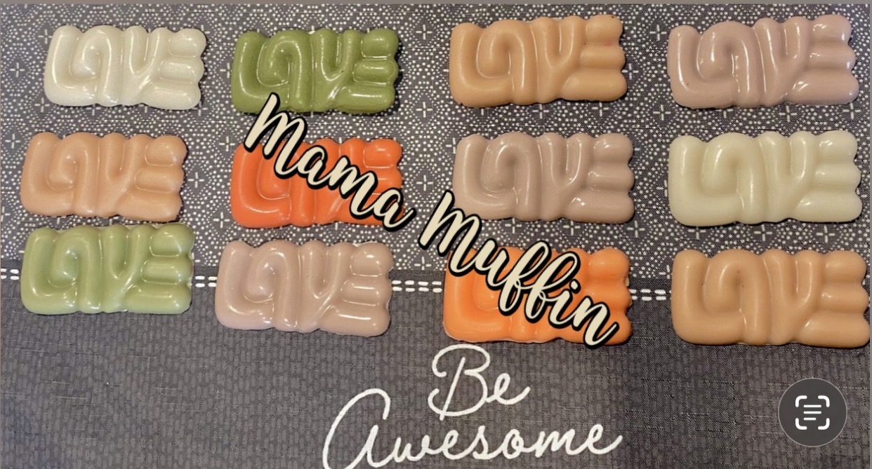 Colorful cookies with words like 'LOVE' and 'DUE' on a gray surface, with text overlay 'mama muffin' and 'Be Awesome'.