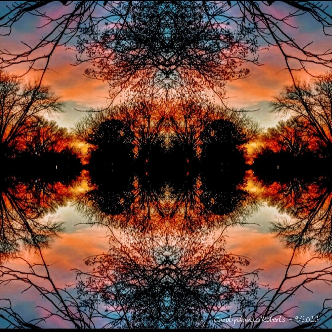 Symmetrical sunset sky with trees and reflection on water, mirrored vertically and horizontally.
