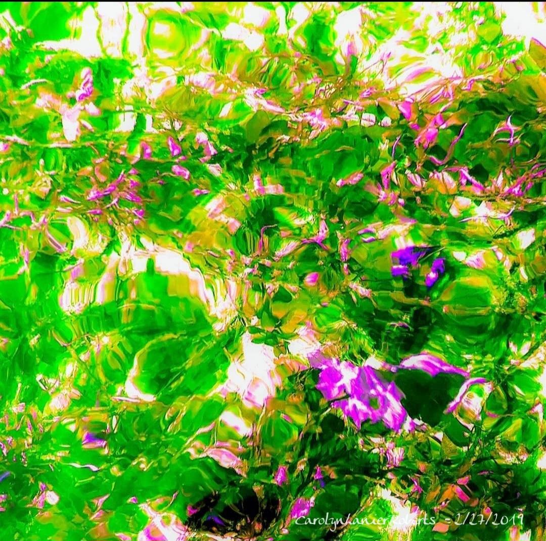 Colorful, distorted image of green and purple plants with bright sunlight, abstract and vibrant appearance.