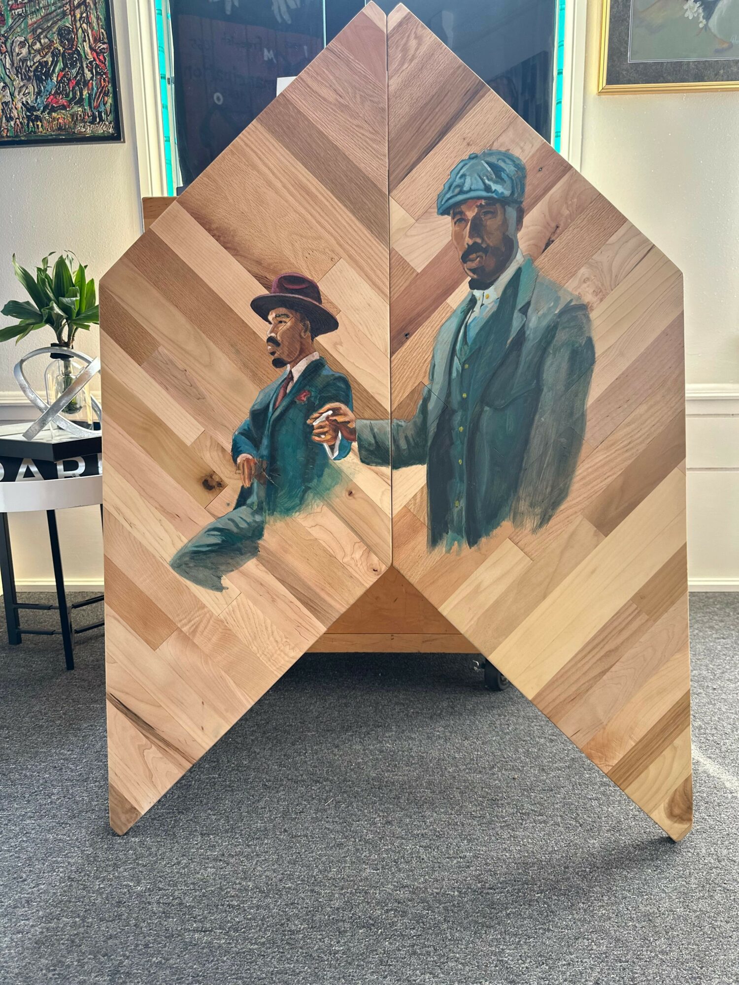 Painting of two people in historical clothing, one holding a book, on a wooden background.
