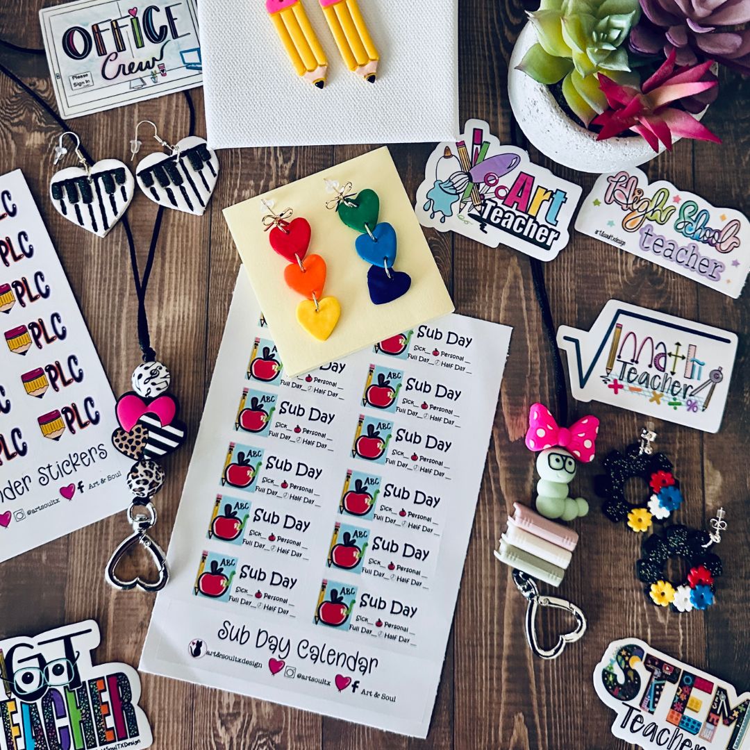 Flat lay of school supplies and decorations on wooden surface, including stickers, keychains, and a calendar.