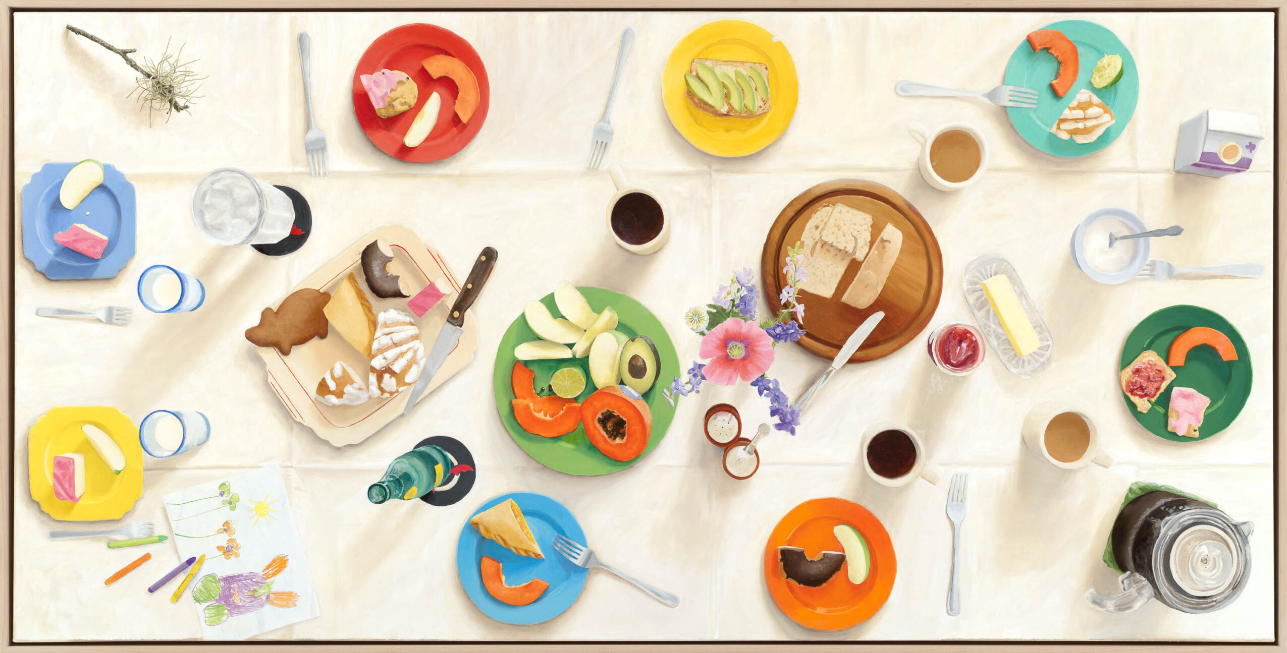 Overhead view of a table with colorful craft supplies, paper plates, scissors, glue, and a camera.