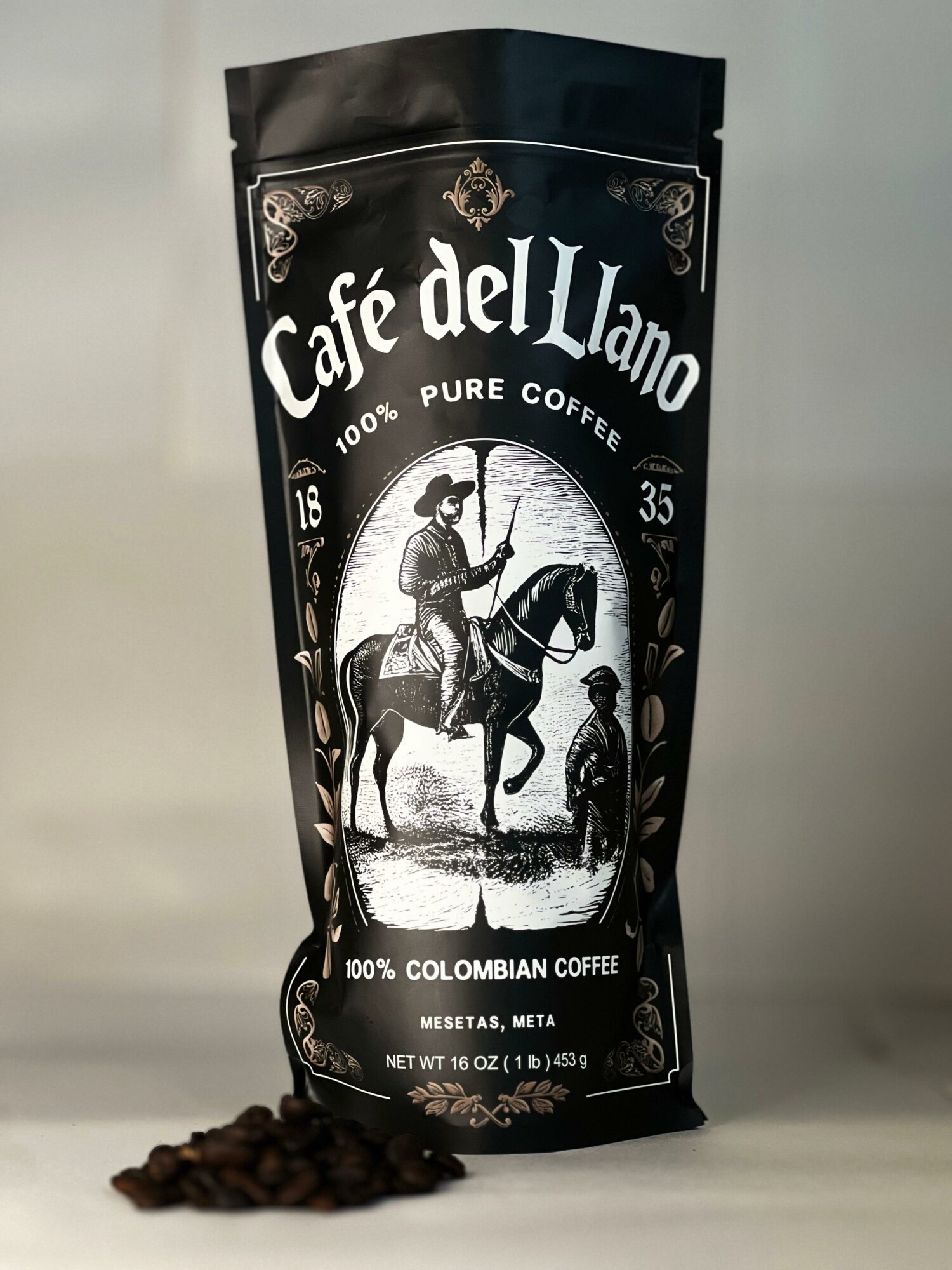 Black coffee bag with white label featuring a man on horseback and a person standing, labeled 'Café del Llano,' 16 oz, 35, 100% Colombian coffee.